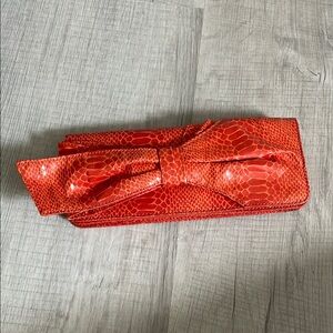 Elegant orange Clutch with Bow Detail